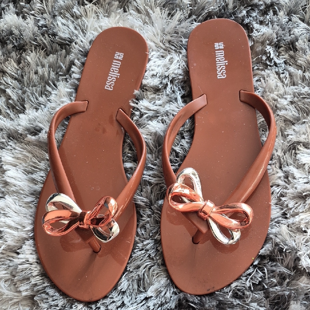 Melissa Brown Flip Flops with Metallic Rose-Gold Bow Accent